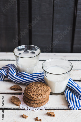 Rustic home made cookies on the wooden background with milk