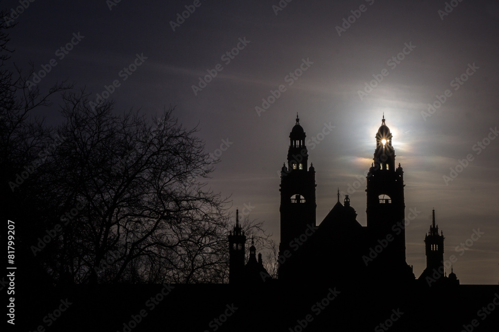 Obraz premium Ancient castle silhouette with sun through one tower.