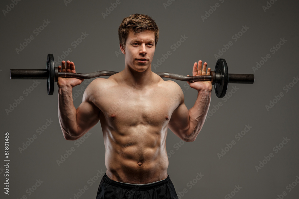 Attractive bodybuilder doing exercises with burbell Attractive bodybuilder doing exercises with burbell
