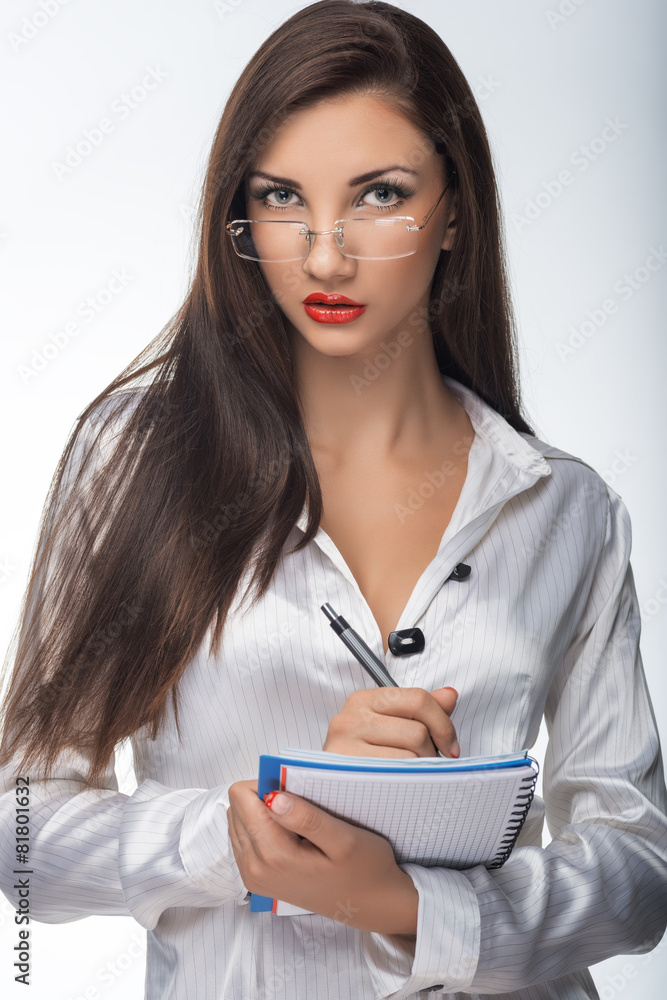 Young woman secretary at work at the office Young woman secretary at work at the office