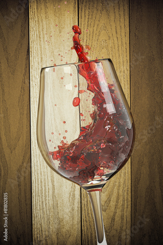 Red Wine Glass and Wooden Background photo