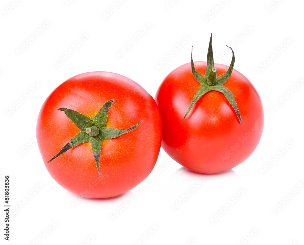 two fresh tomatoes with green leaves isolated on white backgroun two fresh tomatoes with green leaves isolated on white backgroun