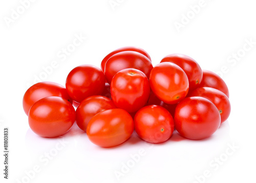 Pile of red grape tomatoes isolated on white background