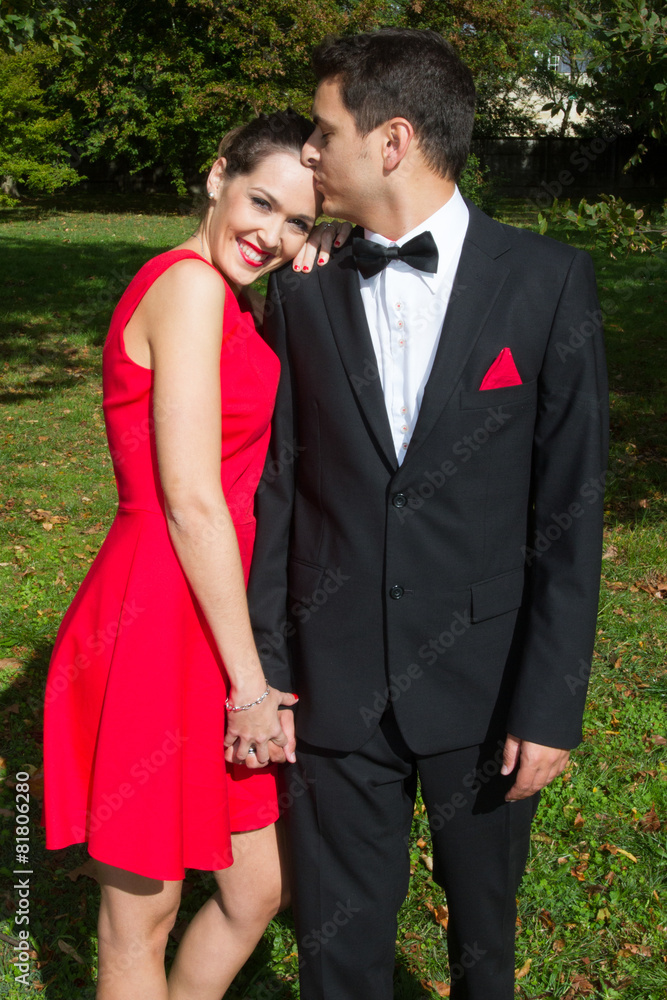 Loving couple in bright clothes dancing on the park Loving couple in bright clothes dancing on the park