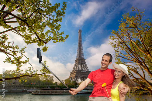 Couple Taking Selfie by Eiffel Tower in Paris, France © Tomas Marek