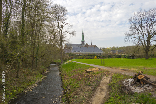 Stream through the park of an abbey in spring photo