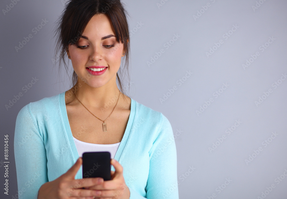Woman using and reading a smart phone Woman using and reading a smart phone
