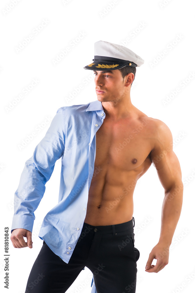 Muscular male sailor with marie hat and shirt covering half