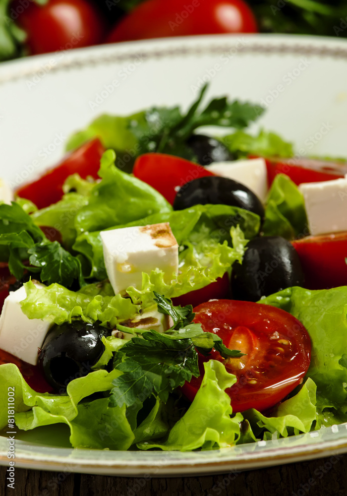 salad with tomatoes, olives and cheese, selective focus salad with tomatoes, olives and cheese, selective focus