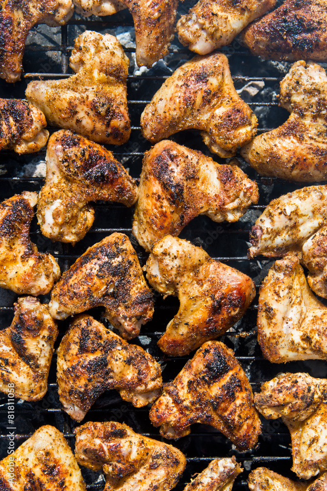 Spiced Chicken Wings on Grill. Seasoned Chicken Wings Barbecue.
