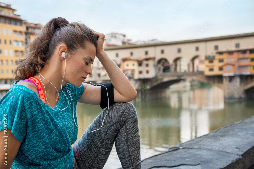 Fitness woman jogging near uffizi gallery in florence, italy