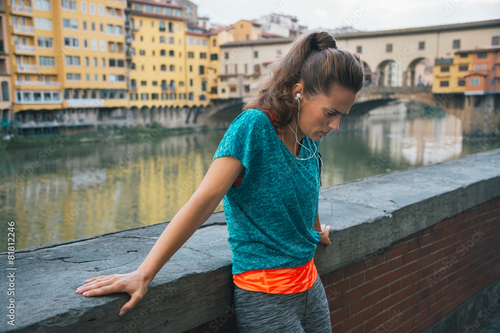 Fitness woman jogging near uffizi gallery in florence, italy