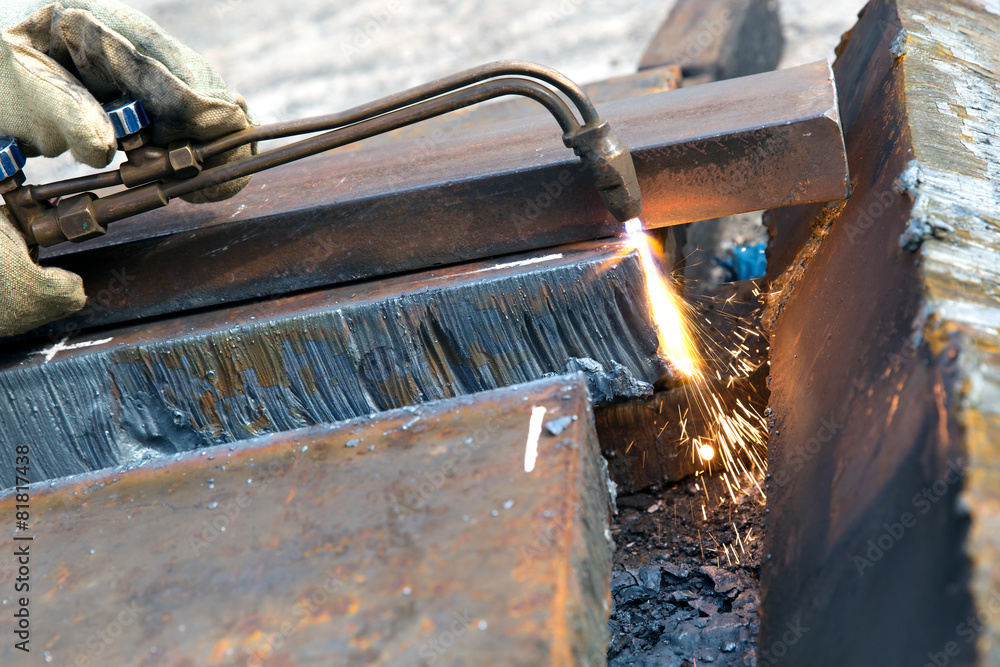 Cutting metal sheet with propane oxygen gas blow torch burner