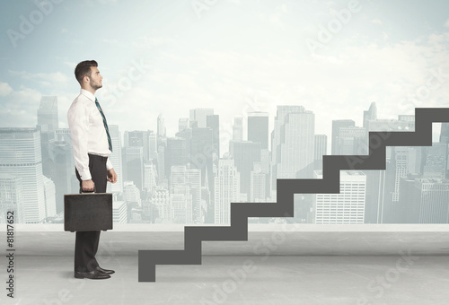 Business person in front of a staircase © ra2 studio