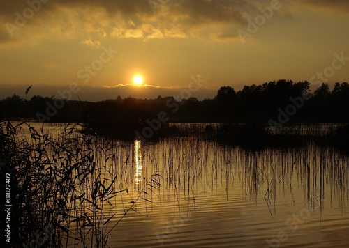 Sunset over the summer lake © puchan