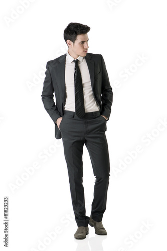 Full figure shot of handsome elegant young man in business suit