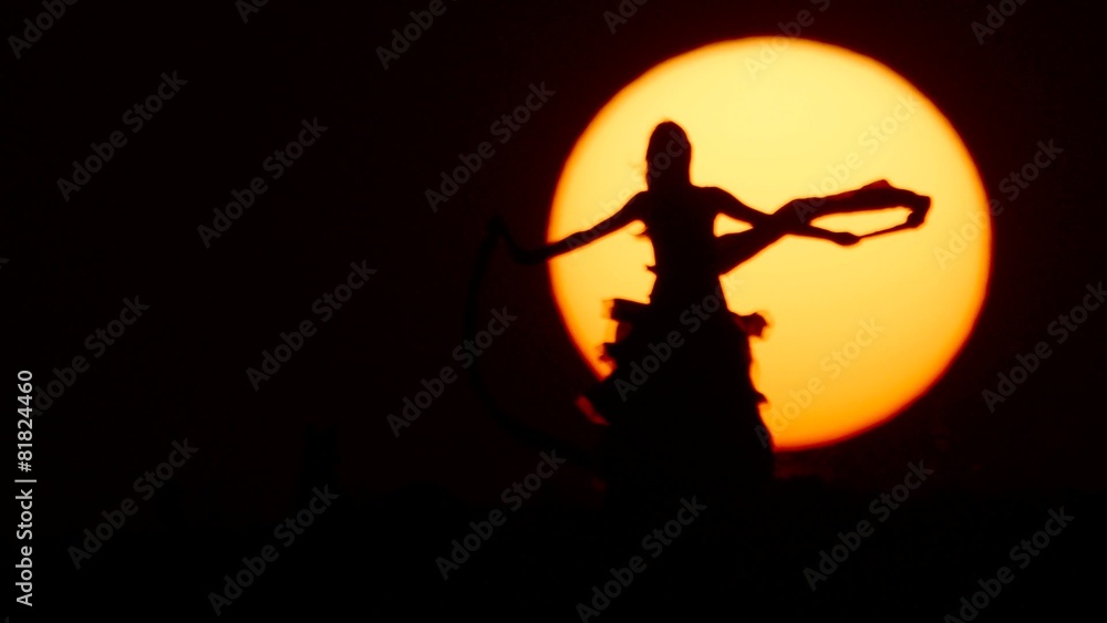 Silhouette of a dancer dancing at sunset Silhouette of a dancer dancing at sunset