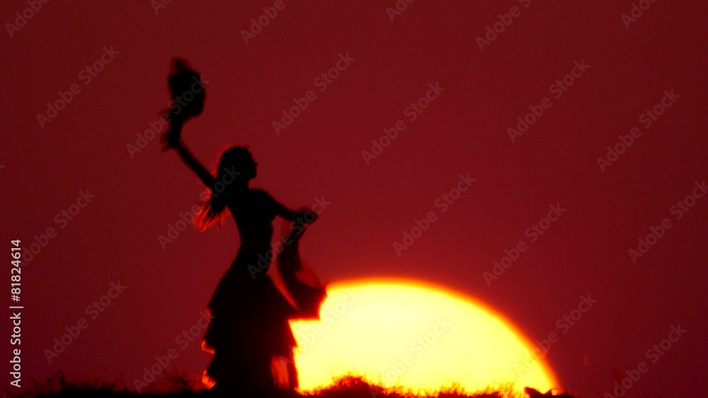 Silhouette of a dancer dancing at sunset Silhouette of a dancer dancing at sunset