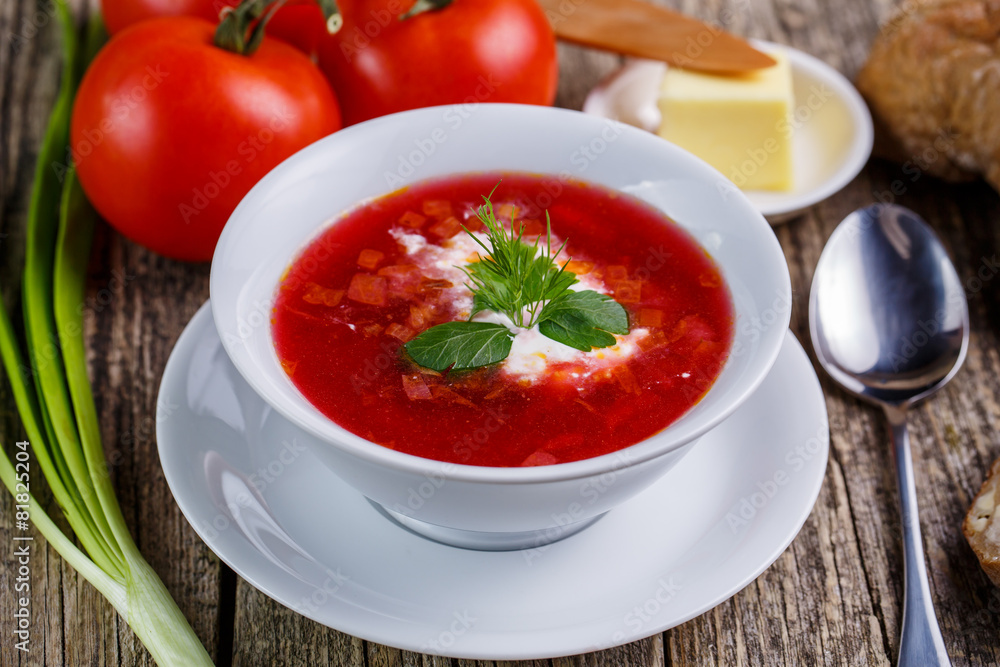 Tasty soup with bread on a wooden background. Tasty soup with bread on a wooden background.