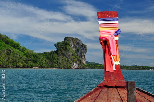 Limestone cliff viewed from a traditional Thai boat