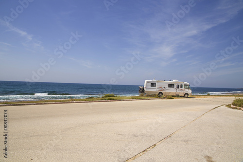 modern caravan beside sea, spring