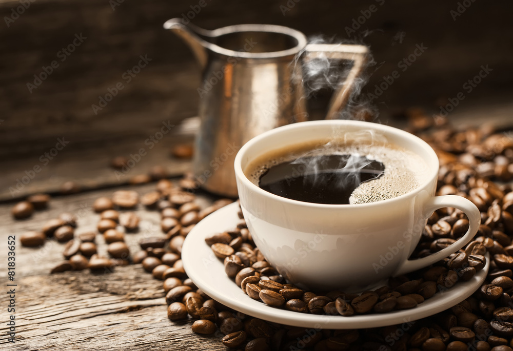 Coffee cup and saucer on a wooden table. Dark background. Coffee cup and saucer on a wooden table. Dark background.
