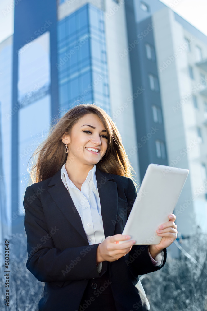 Successful businesswoman or entrepreneur using a digital tablet Successful businesswoman or entrepreneur using a digital tablet