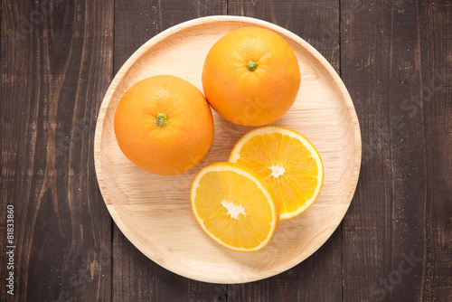 Top view orange fruit on wooden background