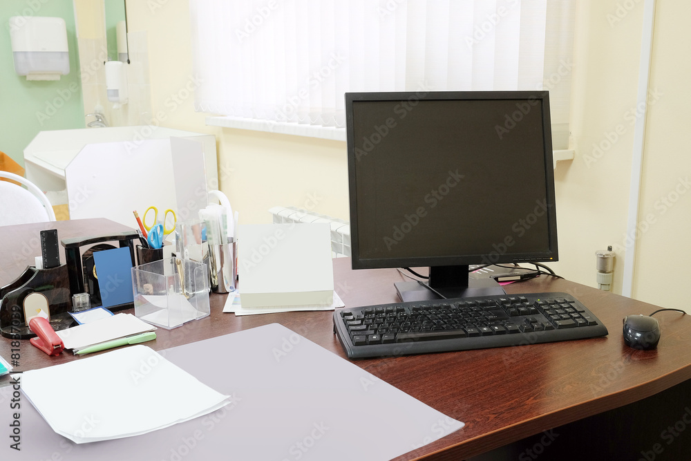 Doctor office table with office tools, monitor, mouse Doctor office table with office tools, monitor, mouse