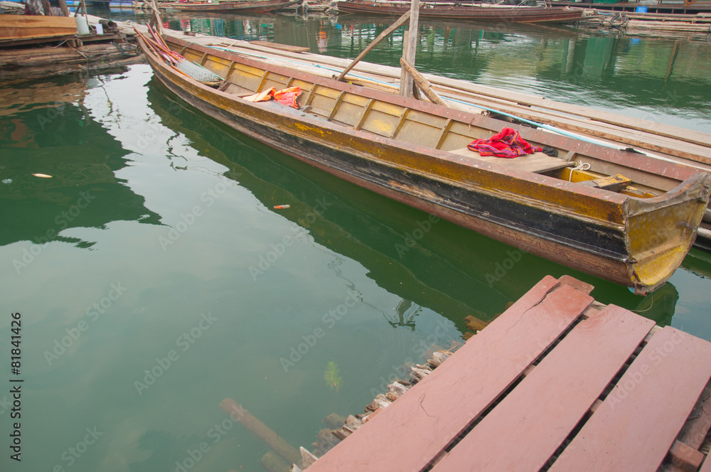 Naklejka premium wood boat at floating village in Kanchanaburi Province, Thailand