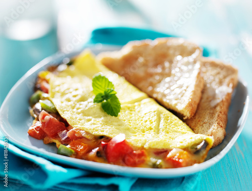 breakfast omelette with buttered toast photo