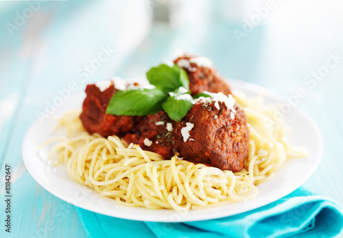 spaghetti and meatballs with parmasan cheese photo