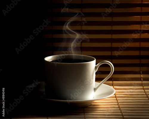 Coffee cup on old wooden background