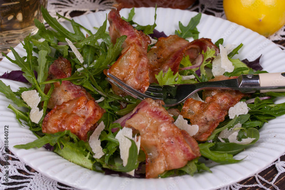 Grilled bacon with parmesan cheese and arugula Grilled bacon with parmesan cheese and arugula