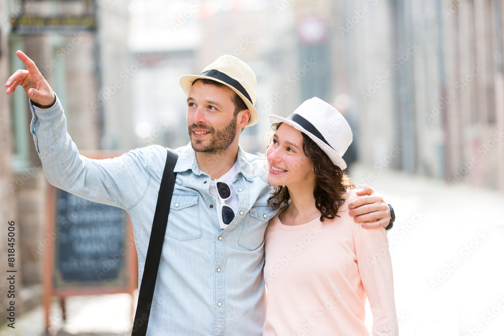 Young couple visiting city during holidays Young couple visiting city during holidays