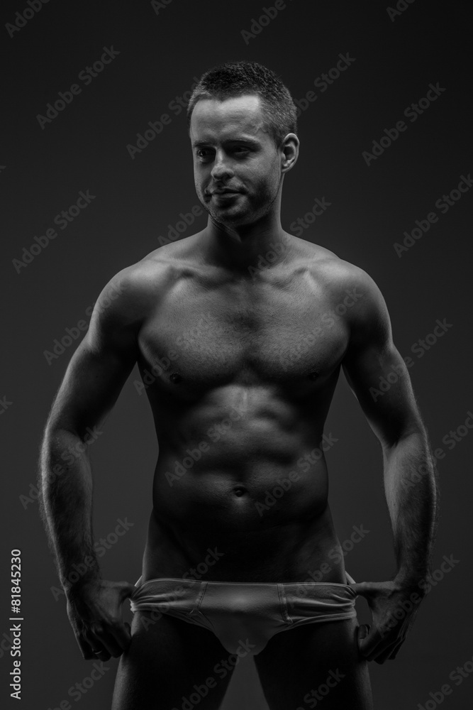 Fototapeta premium Guy in panties posing in studio