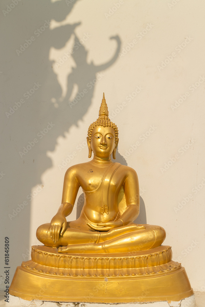 the sitting gold buddha statue under sunlight with deva image the sitting gold buddha statue under sunlight with deva image