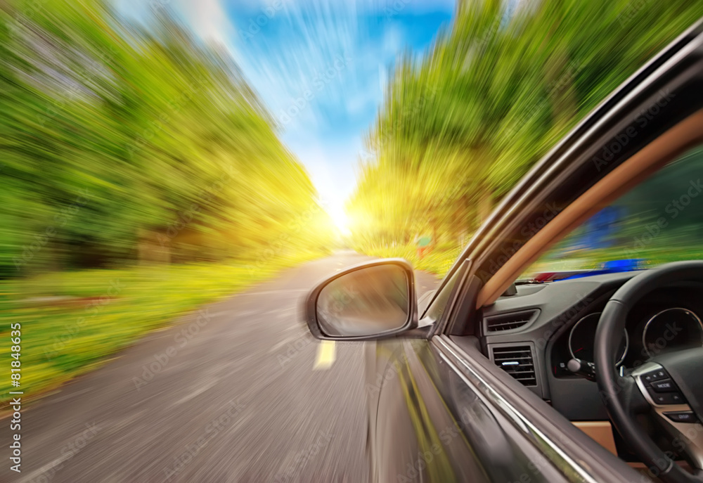 Speeding car, rear view mirror