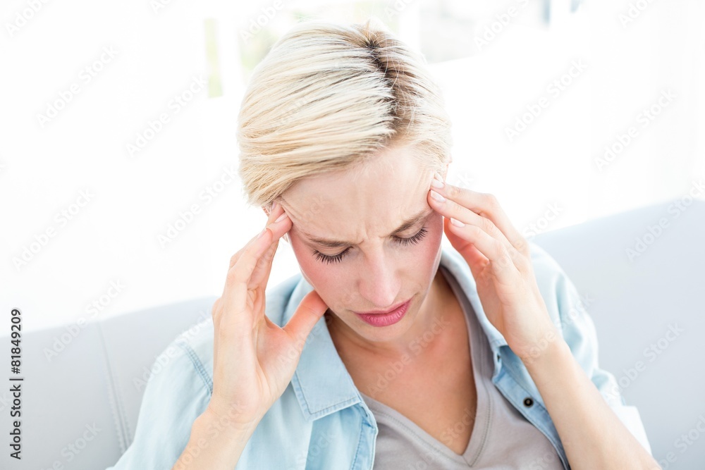 Blonde woman having headache Blonde woman having headache
