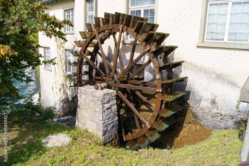 watermill wheel between the house and the kitchen cupboard