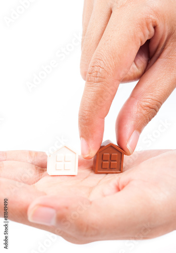 Hand holding house