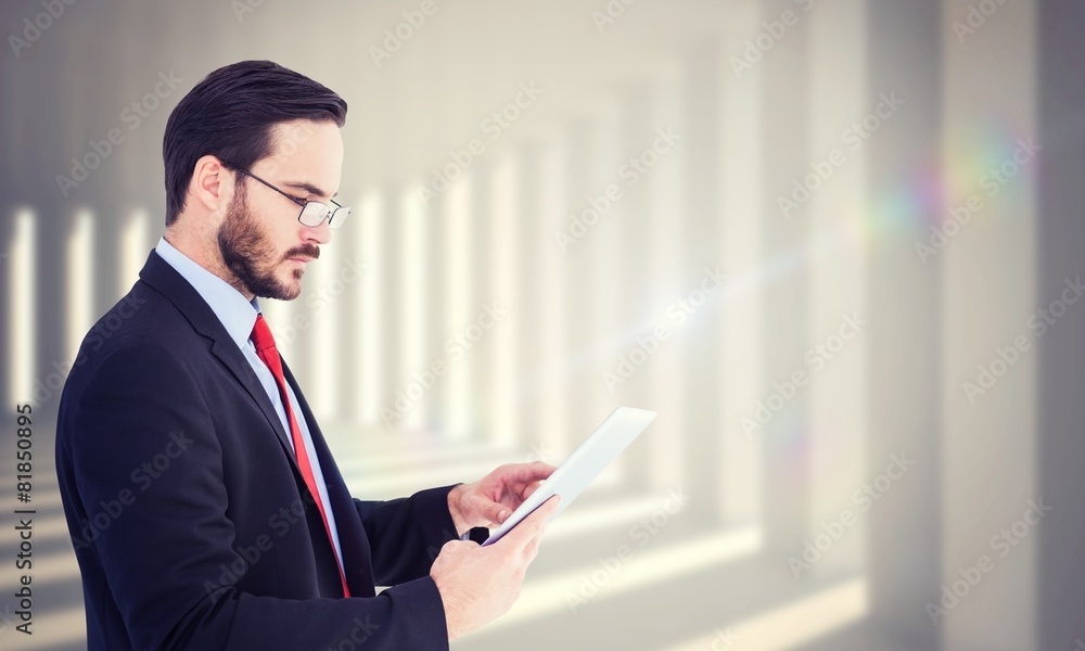 Composite image of businessman scrolling on his digital tablet Composite image of businessman scrolling on his digital tablet