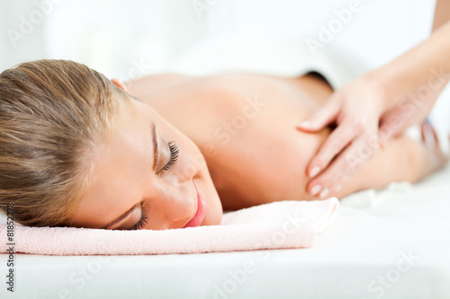 Young woman having arm massage on spa treatment