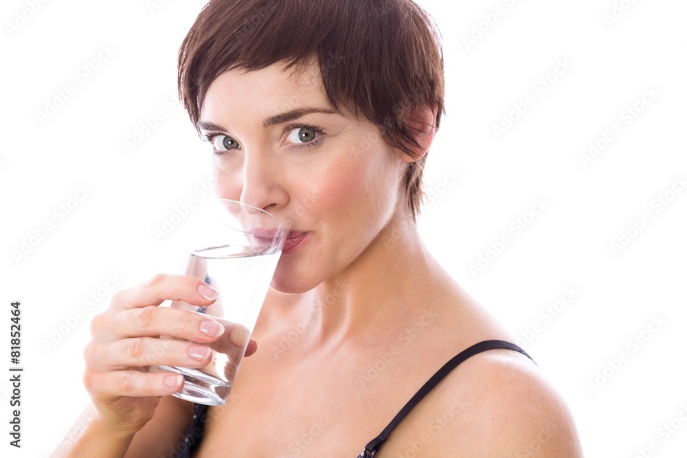 Pregnant woman drinking glass of water Pregnant woman drinking glass of water