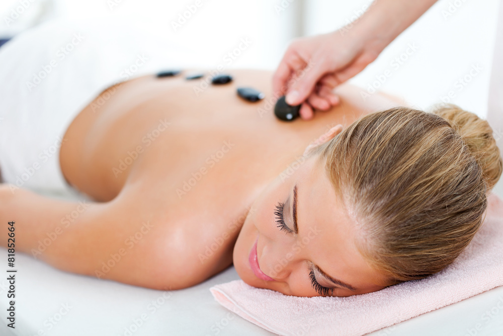 Young woman relaxing after massage on spa treatment Young woman relaxing after massage on spa treatment