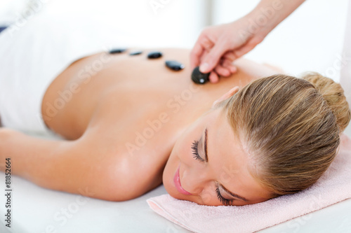 Young woman relaxing after massage on spa treatment