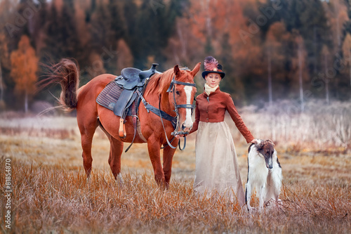 Lady in riding habbit at horse hunting photo