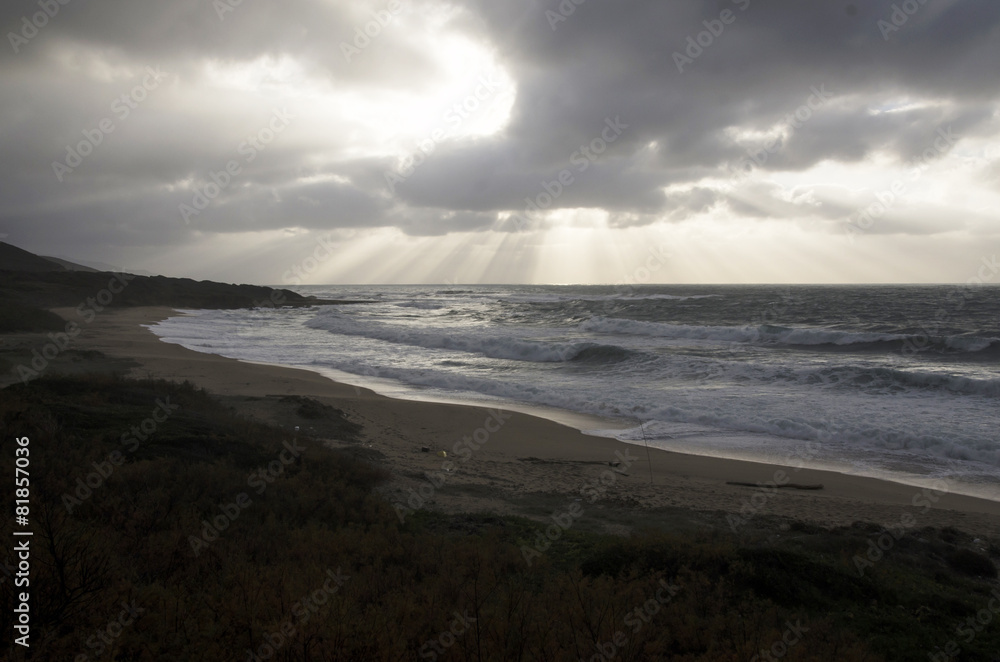 landscape of rough sea, cloudy sky by storm and burst of light