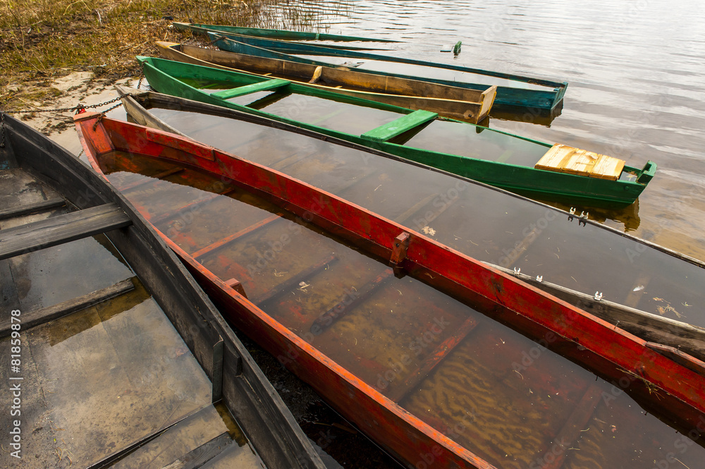 Colored fishing boats on the lake Colored fishing boats on the lake