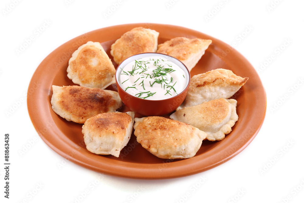 Fried dumplings with onion on plate, isolated on white Fried dumplings with onion on plate, isolated on white